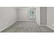 Open bonus room with neutral carpet and a bright window at 327 Oakland Bay Ct, Loganville, GA 30052