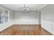Elegant dining room featuring hardwood floors, wainscoting, and a stylish chandelier at 327 Oakland Bay Ct, Loganville, GA 30052