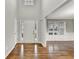 Bright foyer with hardwood floors, neutral walls, and a view into the adjacent room at 327 Oakland Bay Ct, Loganville, GA 30052