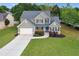 Aerial view of a beautiful two-story home on a spacious lot with a well-manicured lawn at 327 Oakland Bay Ct, Loganville, GA 30052