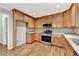 Bright kitchen with stainless steel appliances and plenty of storage in the cabinets at 327 Oakland Bay Ct, Loganville, GA 30052