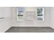 A closet with shelves and hanging rods at 327 Oakland Bay Ct, Loganville, GA 30052