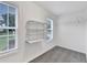 A closet with shelves and two windows at 327 Oakland Bay Ct, Loganville, GA 30052
