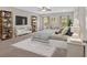 Spacious main bedroom featuring a ceiling fan, large windows, and stylish furnishings at 53 Colonial Ter, Villa Rica, GA 30180