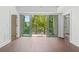 This home features a large private outdoor patio with glass railings and hardwood floors at 1100 Howell Mill Nw Rd # 212, Atlanta, GA 30318
