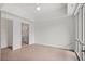 Bright bedroom with a partial view of an ensuite bath and balcony access at 1100 Howell Mill Nw Rd # 212, Atlanta, GA 30318