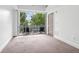 Cozy bedroom with neutral carpet and balcony access, perfect for relaxation at 1100 Howell Mill Nw Rd # 212, Atlanta, GA 30318