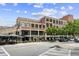 Charming building exterior, featuring retail and restaurant spaces with tree-lined sidewalks and outdoor seating at 1100 Howell Mill Nw Rd # 212, Atlanta, GA 30318