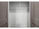 A simple closet has a single wire shelf and provides a storage space at 1100 Howell Mill Nw Rd # 212, Atlanta, GA 30318