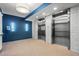 Modern building elevators with stainless steel doors and tiled walls, with blue accent wall at 1100 Howell Mill Nw Rd # 212, Atlanta, GA 30318