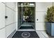 Elegant glass entrance with prominent business logo, framed by sleek modern design and greenery at 1100 Howell Mill Nw Rd # 212, Atlanta, GA 30318