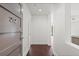 Inviting entryway with wood floors and a view into the living space and kitchen at 1100 Howell Mill Nw Rd # 212, Atlanta, GA 30318