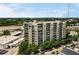 Multi-story building featuring modern architecture with large windows and lush greenery around at 1100 Howell Mill Nw Rd # 212, Atlanta, GA 30318