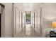 Well-lit hallway with polished floors, elegant wainscoting, and stylish chandeliers at 1100 Howell Mill Nw Rd # 212, Atlanta, GA 30318