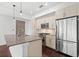 Bright kitchen featuring stainless steel appliances, a center island, and ample cabinet space at 1100 Howell Mill Nw Rd # 212, Atlanta, GA 30318