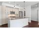 Contemporary kitchen with stainless steel appliances, center island, and stylish pendant lighting at 1100 Howell Mill Nw Rd # 212, Atlanta, GA 30318