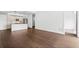 Spacious living room with dark hardwood floors and view to a modern kitchen at 1100 Howell Mill Nw Rd # 212, Atlanta, GA 30318