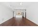Bright living room with an open-concept kitchen and sleek hardwood floors at 1100 Howell Mill Nw Rd # 212, Atlanta, GA 30318