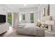 Serene main bedroom with natural light, balcony access, and neutral decor at 1100 Howell Mill Nw Rd # 212, Atlanta, GA 30318