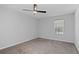 An empty bedroom with neutral carpet, a ceiling fan, and a window at 1150 Collier Nw Rd # 6H, Atlanta, GA 30318