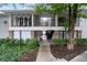 Exterior view of the building with well-maintained landscaping at 1150 Collier Nw Rd # 6H, Atlanta, GA 30318
