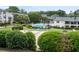 Community pool with lounge chairs, volleyball court, landscaping, and nearby apartments at 1150 Collier Nw Rd # 6H, Atlanta, GA 30318
