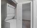 An in-unit laundry closet containing a stacked washer and dryer appliance at 1150 Collier Nw Rd # 6H, Atlanta, GA 30318