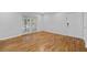 Bright living room featuring hardwood floors and large sliding windows at 1150 Collier Nw Rd # 6H, Atlanta, GA 30318