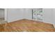Bright living room featuring hardwood floors and sliding glass doors at 1150 Collier Nw Rd # 6H, Atlanta, GA 30318