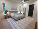Well-lit bedroom featuring natural light, a ceiling fan, and a neutral color scheme at 1820 Lake Dow Rd, Mcdonough, GA 30252