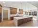 Modern kitchen with a large island, wood cabinets, and stainless steel appliances at 1820 Lake Dow Rd, Mcdonough, GA 30252