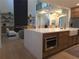 Bright kitchen island with a view of the living room with fireplace at 1820 Lake Dow Rd, Mcdonough, GA 30252