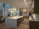 Modern kitchen with quartz island, wooden cabinetry, and stainless steel appliances at 1820 Lake Dow Rd, Mcdonough, GA 30252