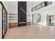 Bright living room with fireplace, shelving, hardwood floors, and access to the backyard at 1820 Lake Dow Rd, Mcdonough, GA 30252
