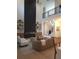 Bright living room features a fireplace, hardwood floors, and a modern sofa at 1820 Lake Dow Rd, Mcdonough, GA 30252