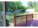 Relaxing back deck with nice railings overlooks the lawn and garden area at 5574 Mccrossin Cir, Lithonia, GA 30038