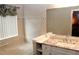 Bright bathroom with tiled walls, modern vanity and soaking tub at 5574 Mccrossin Cir, Lithonia, GA 30038