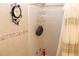 Bathroom shower with mosaic accent tile and shower caddy at 5574 Mccrossin Cir, Lithonia, GA 30038