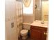 Bathroom with tiled walls, updated vanity and commode at 5574 Mccrossin Cir, Lithonia, GA 30038