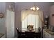 Bright breakfast nook showcases a decorative light fixture, table, and a view of kitchen's backsplash, enhancing its charm at 5574 Mccrossin Cir, Lithonia, GA 30038