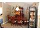 Elegant dining room with traditional wood table, chandelier, and glass display cabinet providing an inviting atmosphere at 5574 Mccrossin Cir, Lithonia, GA 30038