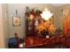 Traditional dining room with wood table, chandelier and dark wood hutch at 5574 Mccrossin Cir, Lithonia, GA 30038