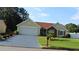 Charming single-story home features a lush lawn and well-maintained landscaping, complemented by a paved driveway at 5574 Mccrossin Cir, Lithonia, GA 30038