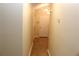 Bright hallway features neutral paint, chandelier and high ceiling at 5574 Mccrossin Cir, Lithonia, GA 30038