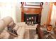 Cozy living room showcases a traditional fireplace with mantel, complemented by decorative candles and comfortable seating at 5574 Mccrossin Cir, Lithonia, GA 30038