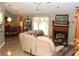 Spacious living room with a fireplace, tile flooring and a comfortable recliner sofa, perfect for relaxation at 5574 Mccrossin Cir, Lithonia, GA 30038