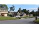 Quiet suburban street showcases well-maintained homes and lush green lawns at 5574 Mccrossin Cir, Lithonia, GA 30038