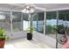 A sunroom featuring a ceiling fan, and views of the outdoor fenced in yard at 5574 Mccrossin Cir, Lithonia, GA 30038