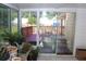 A bright sunroom with a sliding glass door leading to an outdoor patio at 5574 Mccrossin Cir, Lithonia, GA 30038