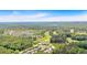An aerial view displays the community, golf course, and wooded areas at 18 Torry Pines Cir, Villa Rica, GA 30180